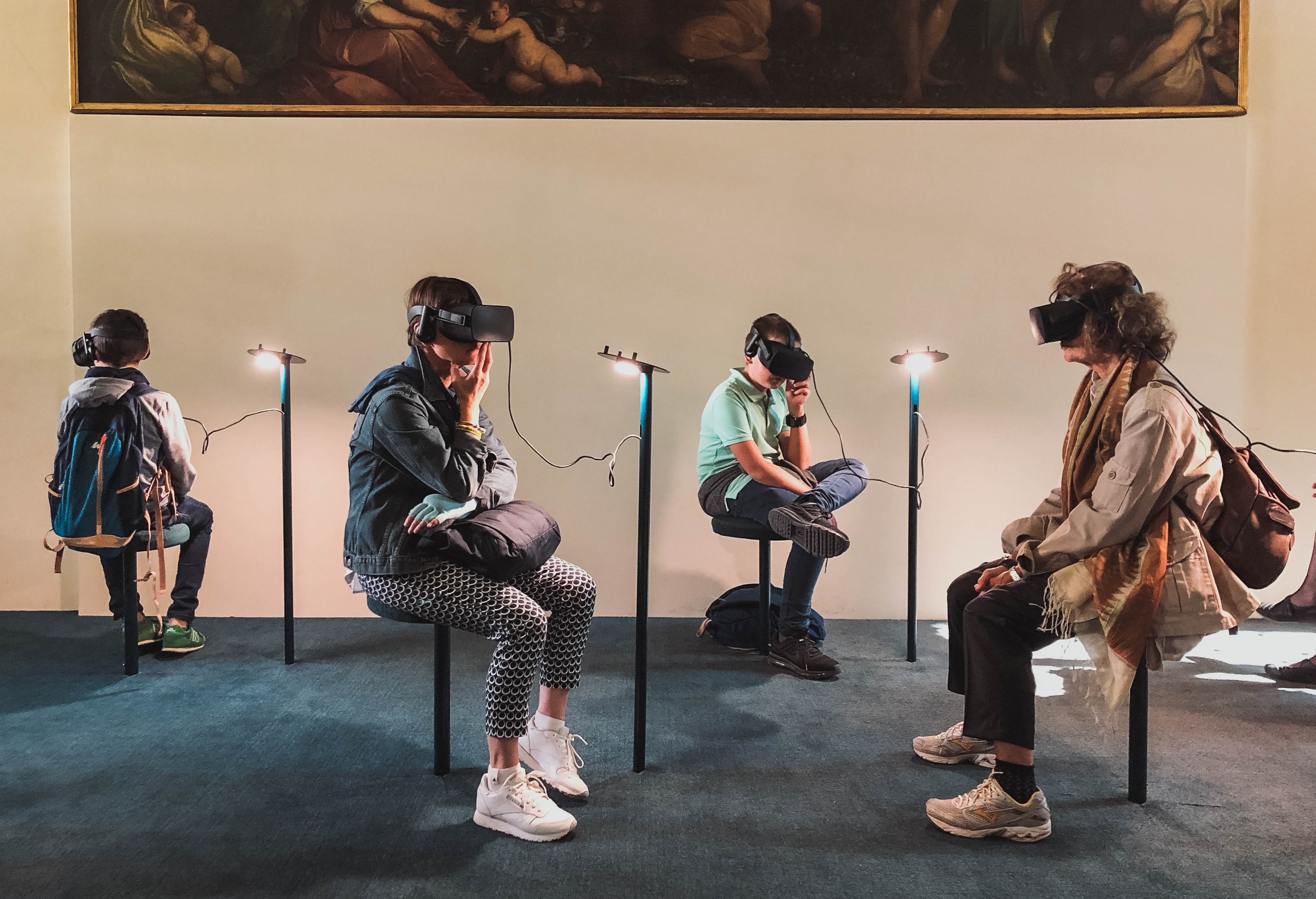 four people playing vr